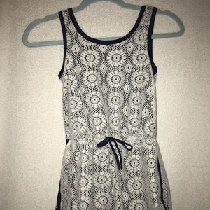 Sporty romper with lace/ mesh detailing on top.